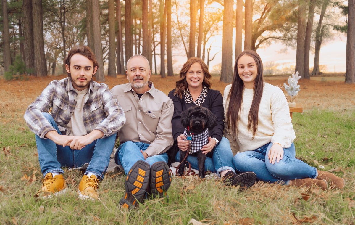 Cole, Greg, Lori, and Hannah with Ryder the dog, the family that owns Cohan Properties, in East Texas